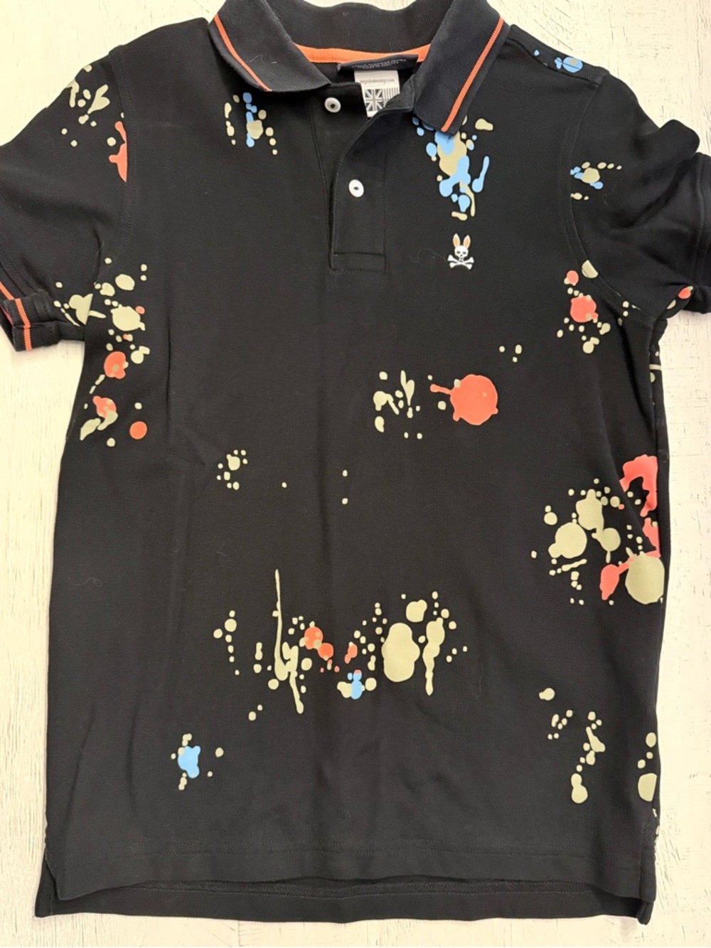 Psycho Bunny Black Polo with Red, Blue & Cream Paint Splatter